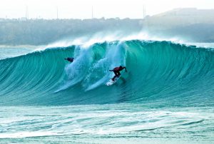 Surfers carving up